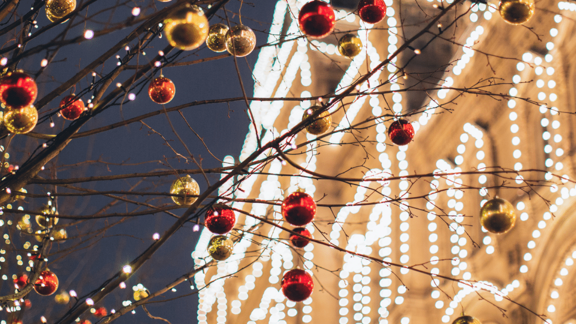 image of tree baubles and lit building